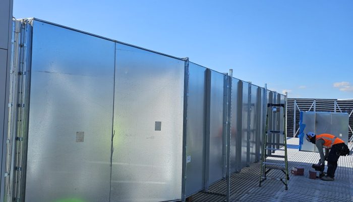Ben Air technicians working on commercial HVAC duct installation on a rooftop in Auckland.